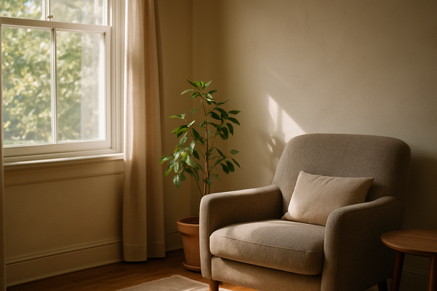 alt_text: A serene living room corner with sunlight and a plant, evoking a sense of calm.